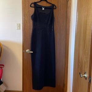 Stunning black floor length gown with mesh and rhinestone detailing.